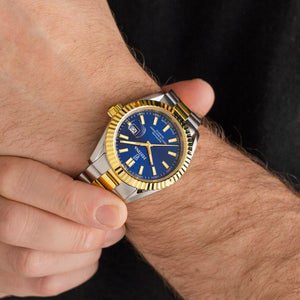Festina F20085/B herreur på håndled med blå skive, stål/guld lænke og klassisk Swiss Made design.