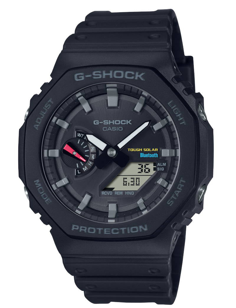 Et Casio G-Shock B2100-1AER ur i sort, med en robust og holdbar konstruktion. Uret har en digital og analog visning, Bluetooth-forbindelse, Tough Solar-teknologi og forskellige funktioner, herunder alarm og verdensur.