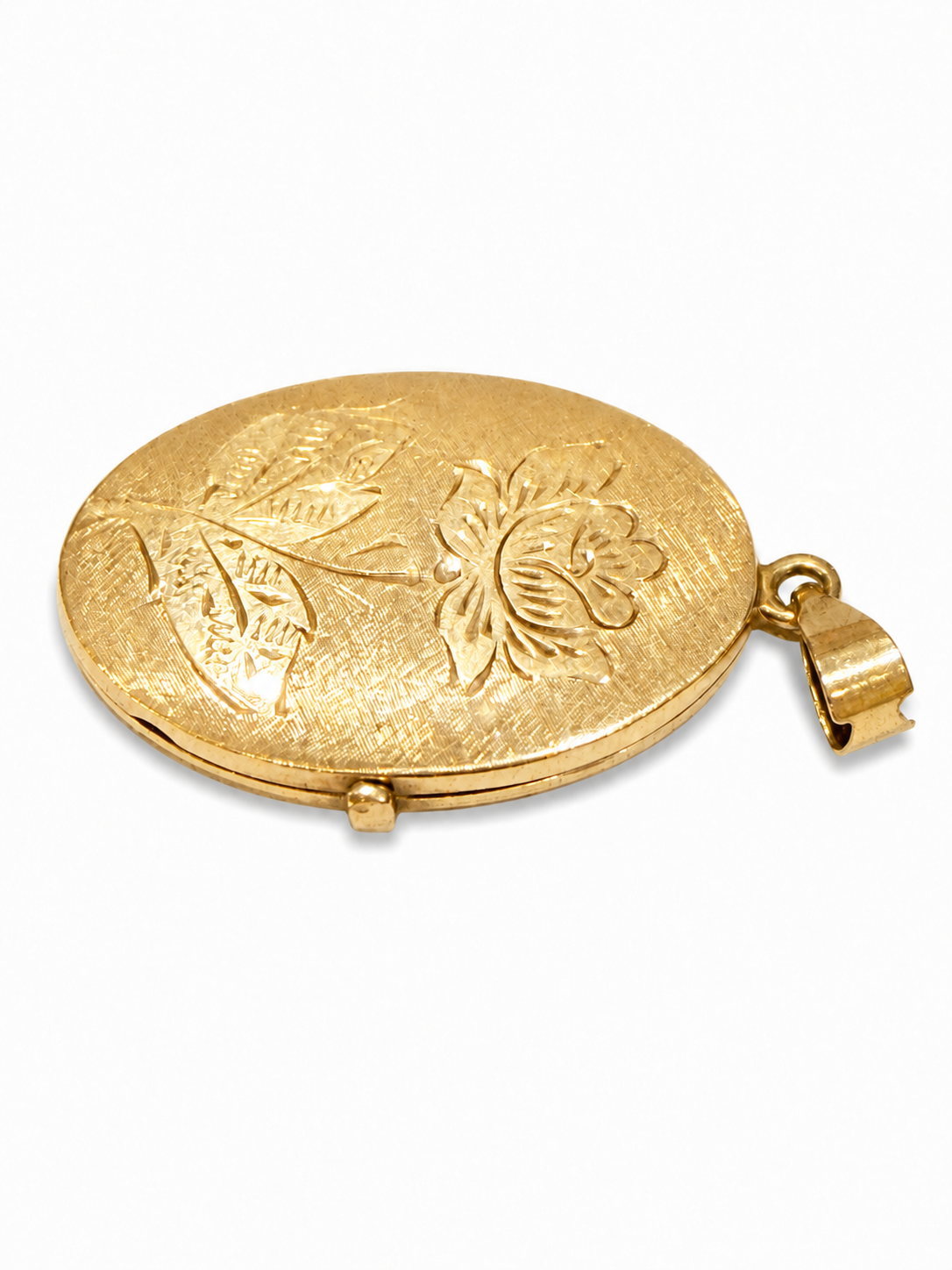 Oval medaljon med graveret blomstermotiv set fra siden [ai-redigeret]