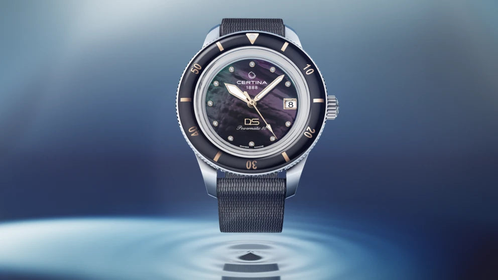Frontvisning af Certina DS PH200M 39mm – gyldne markeringer og dykkerring i fokus.