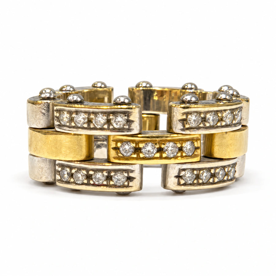 Brugt Dimension ring i tofarvet 14 kt. guld med fem diamantbesatte led, blanke guldfarvede og sølvfarvede sektioner samt synlige brugsspor. Størrelse 50, vægt 13,6 g, varenummer 95163407 [ai-redigeret]