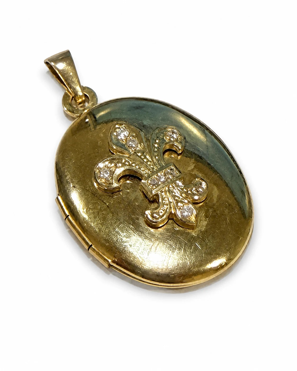 Brugt medaljon i 14 kt. guld med liljemotiv og zirkonia, front [ai-redigeret]
