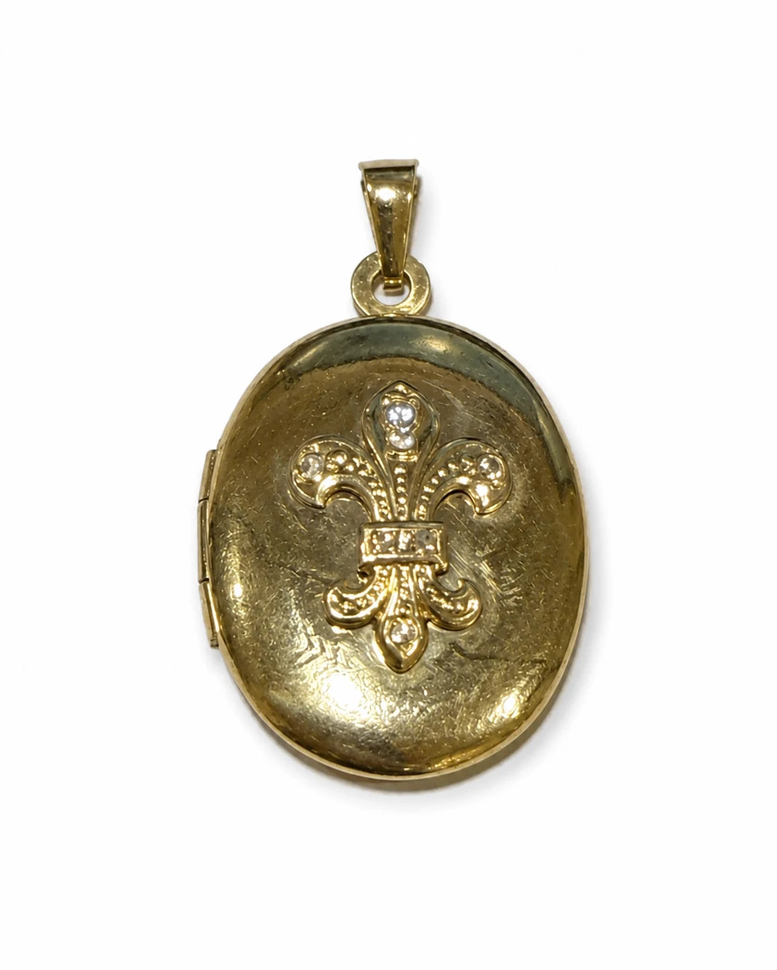 Brugt oval medaljon i 14 kt. guld med lilje og zirkonia set lige forfra [ai-redigeret]