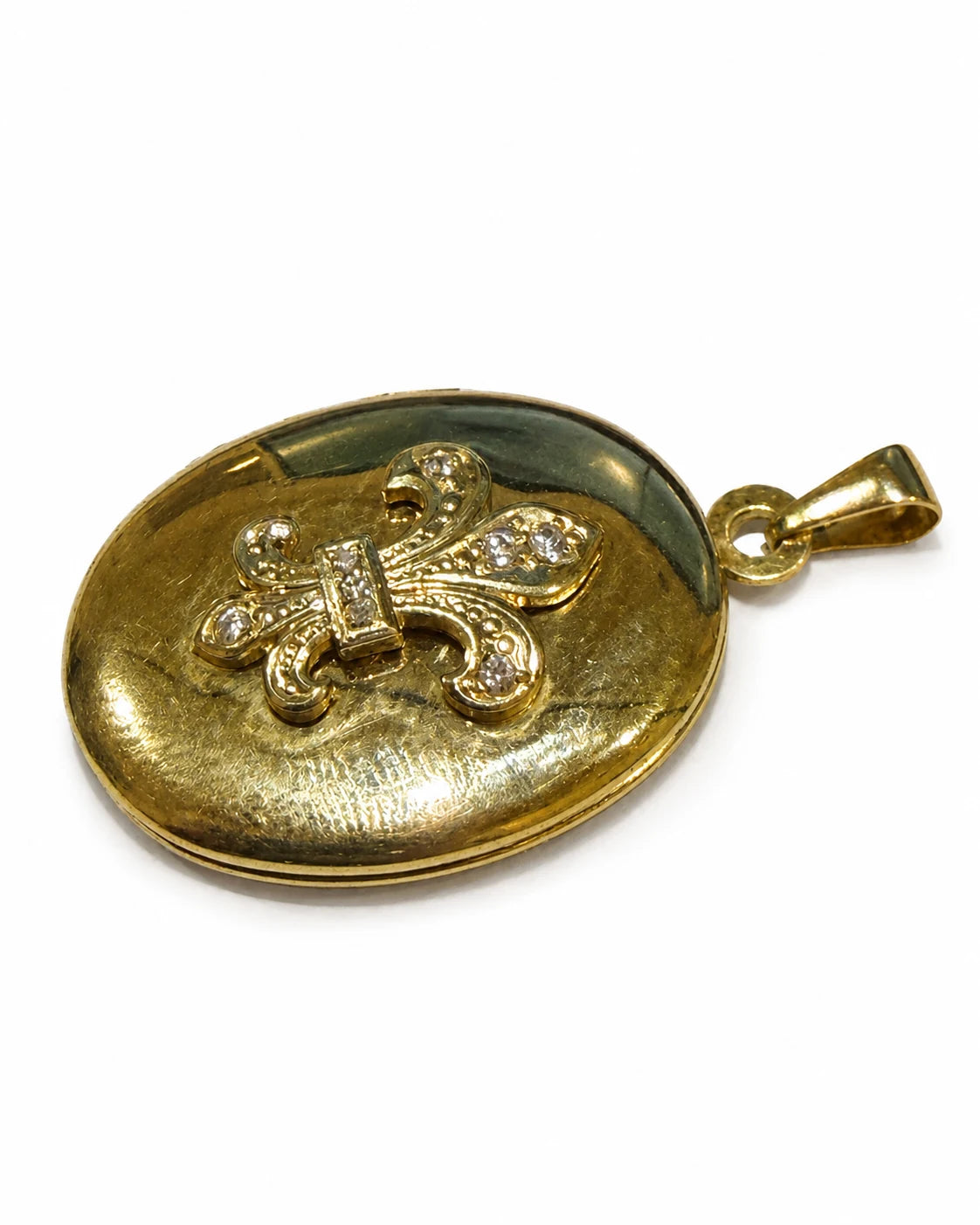 Brugt medaljon i 14 kt. guld med liljemotiv og zirkonia set fra siden [ai-redigeret]