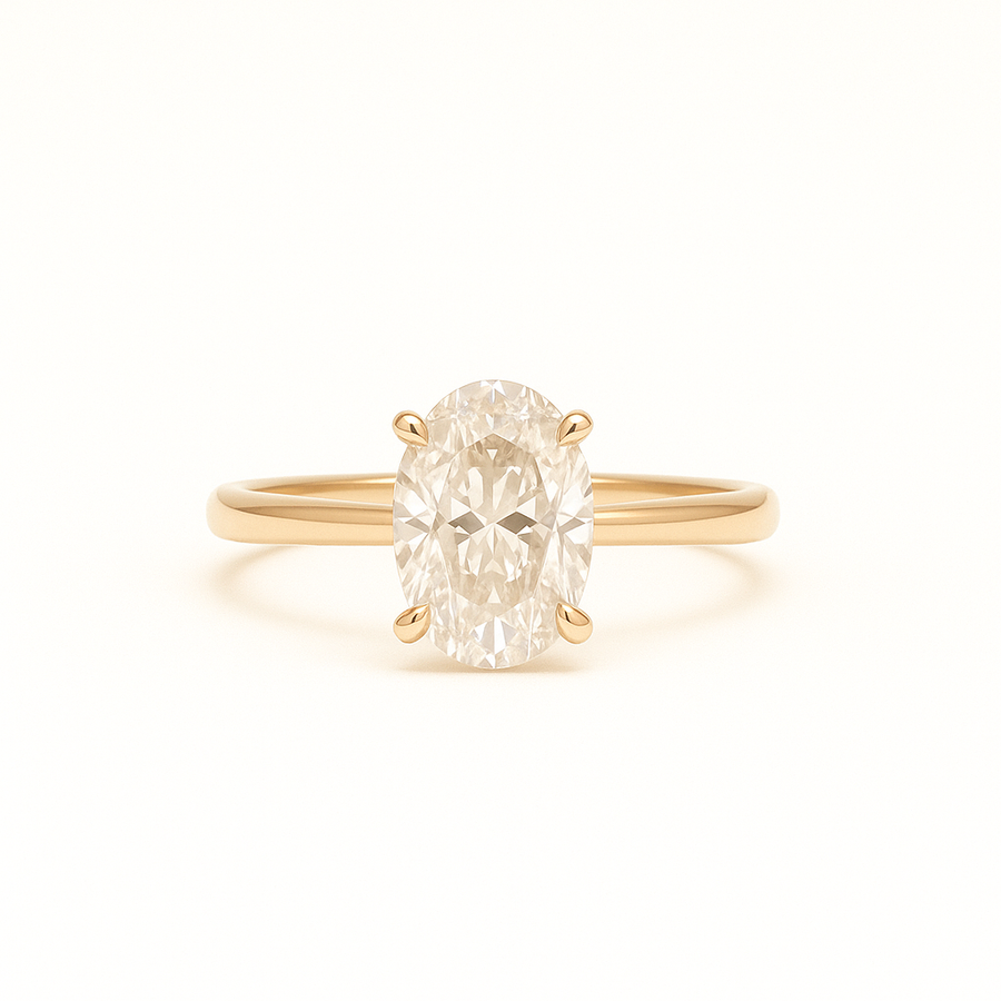 Solitaire ring i 14kt guld med 1,50 ct oval cut labgrown diamant fra ALMA Collection. Frontvisning af blankpoleret ringskinne og stor centreret oval diamant i dansk design.